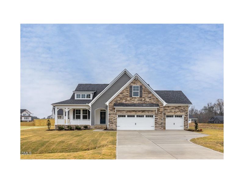 Front exterior of a new home in Tobacco Road, Angier, NC, highlighting curb appeal (Image 1).
