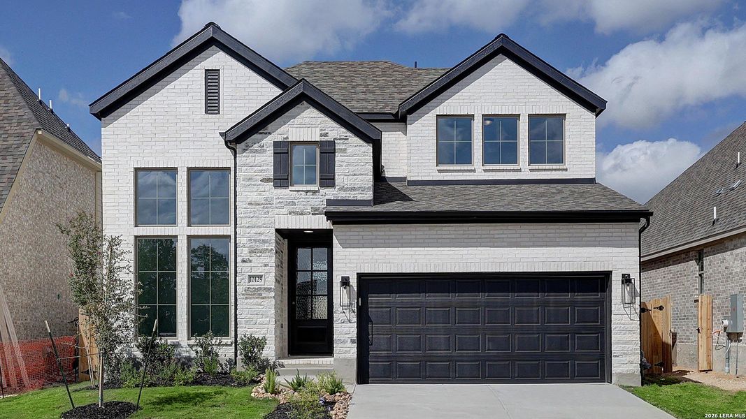 Front exterior of a new home in Kallison Ranch, San Antonio, TX, highlighting curb appeal (Image 2). Front exterior of a new home in Kallison Ranch, San Antonio, TX, highlighting curb appeal (Image 2).