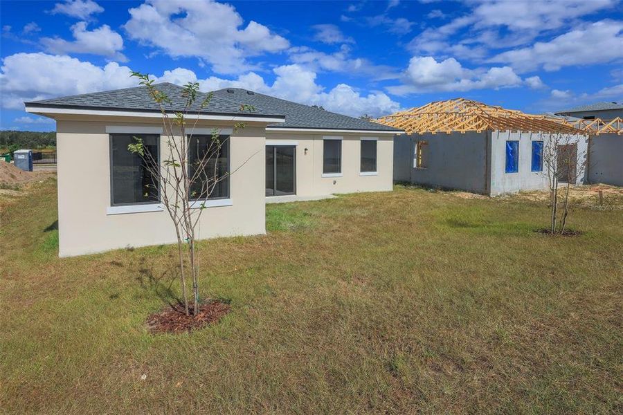 Front exterior of a new home in On Villa Pass, Mascotte, FL, highlighting curb appeal (Image 23). Front exterior of a new home in On Villa Pass, Mascotte, FL, highlighting curb appeal (Image 23).