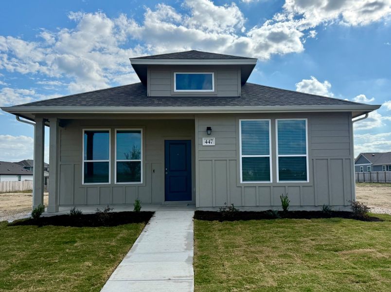 Front exterior of a new home in Porter Country, Buda, TX, highlighting curb appeal (Image 1). Front exterior of a new home in Porter Country, Buda, TX, highlighting curb appeal (Image 1).