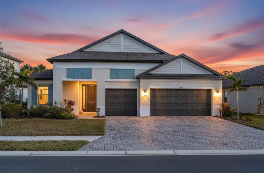 Front exterior of a new home in , Palmetto, FL, highlighting curb appeal (Image 1).