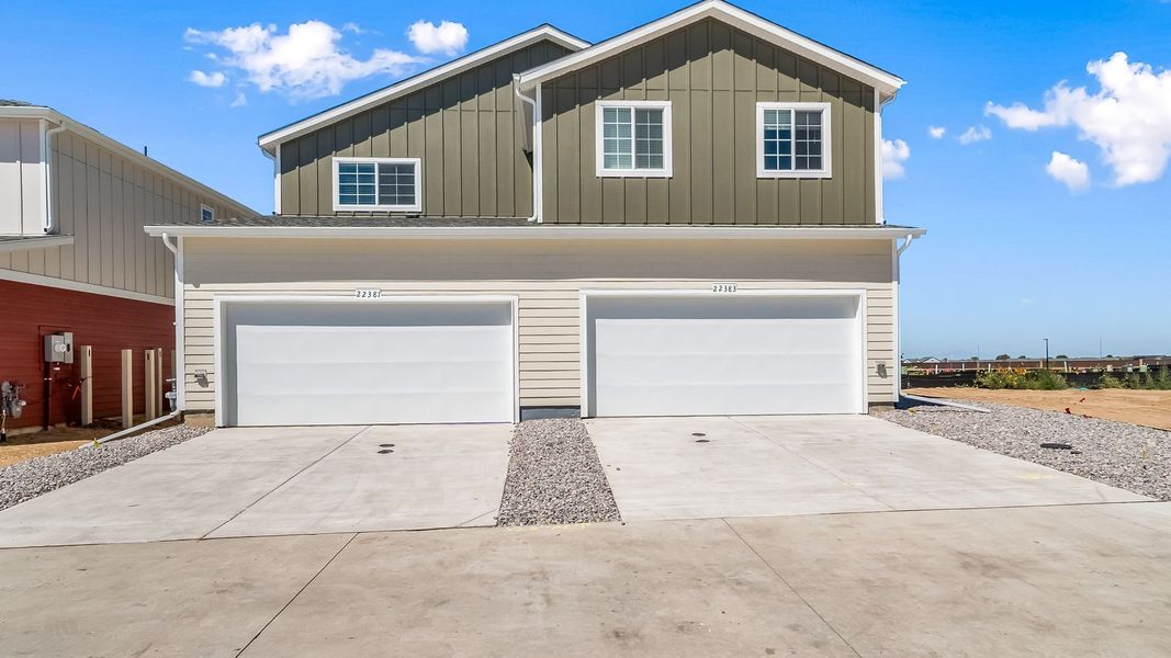 Front exterior of a new home in Green Valley Ranch, Aurora, CO, highlighting curb appeal (Image 19). Front exterior of a new home in Green Valley Ranch, Aurora, CO, highlighting curb appeal (Image 19).