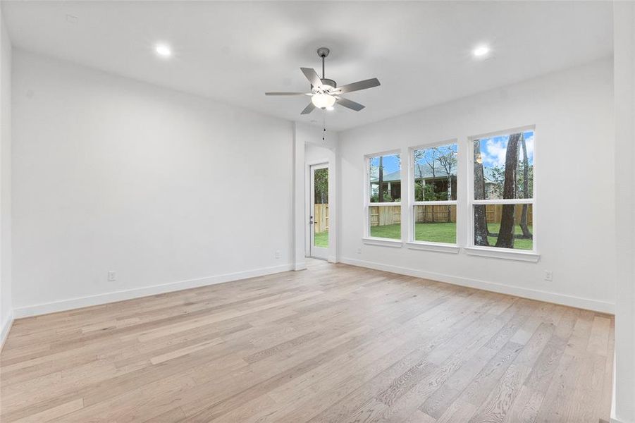 Game Room (or whatever suits you) with Engineered Hardwood Flooring and Fan.