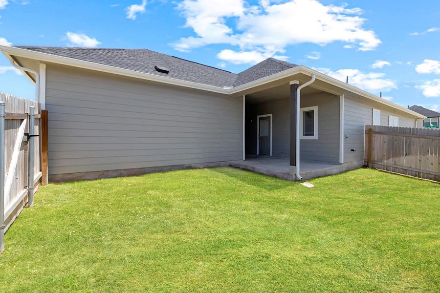 Back of house featuring roof with shingles, a fenced backyard, and a patio area Back of house featuring roof with shingles, a fenced backyard, and a patio area
