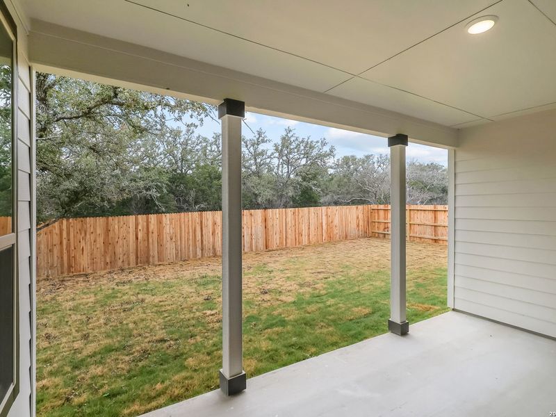 Exterior details and patio area of a home in The Reserve at Potranco Oaks, Castroville (Image 32).