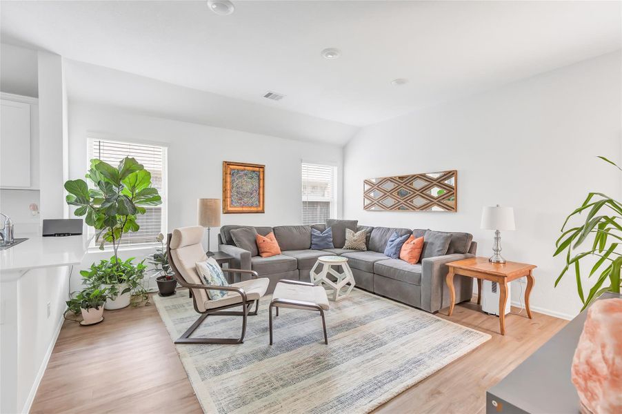 This home has a fantastic open floor plan. Family room with double windows and vinyl plank flooring throughout main areas of home.