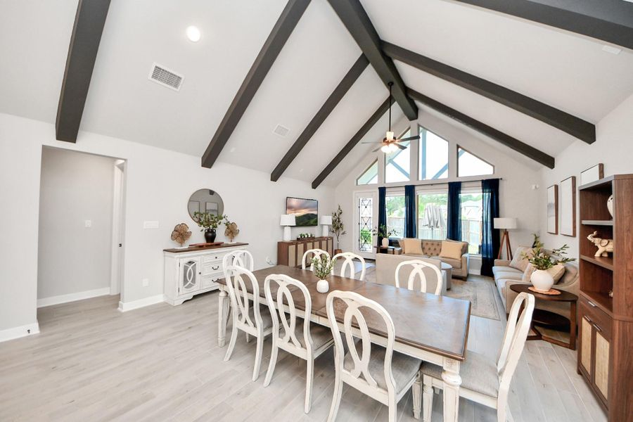 Open dining and family room—soaring ceilings and abundant natural light.