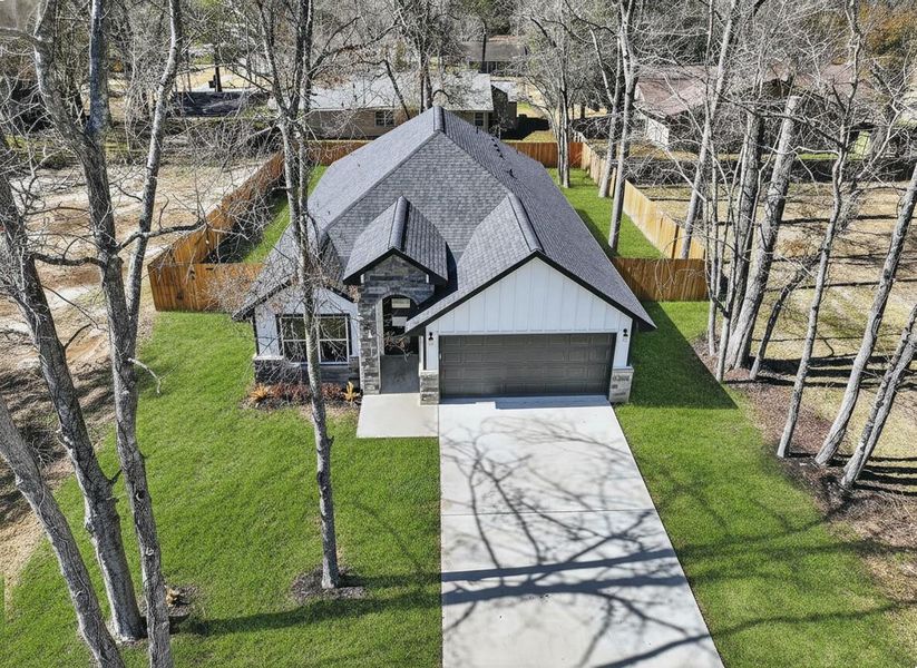 Front exterior of a new home in , Cleveland, TX, highlighting curb appeal (Image 19).