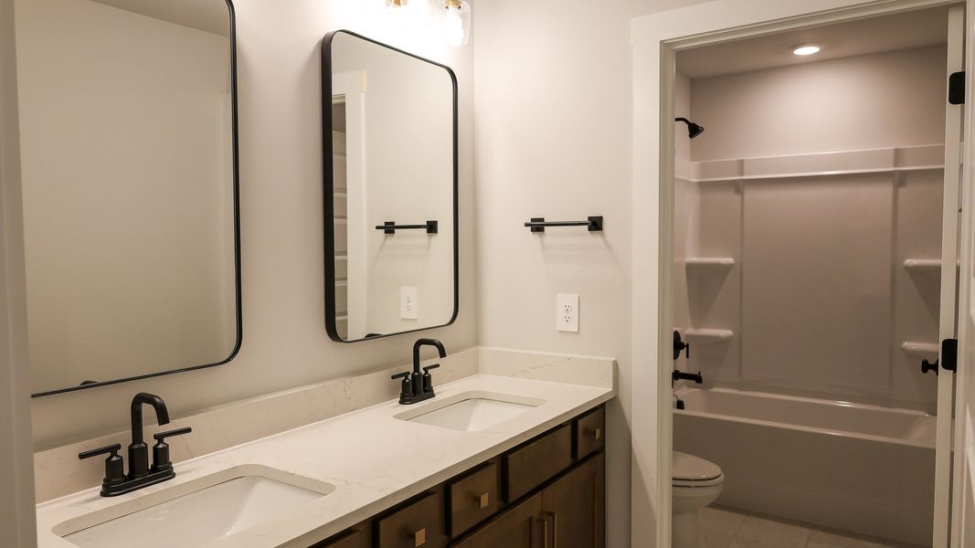 Representative furnished interior of a home built from the TISDALE by D.R. Horton in Harvest Point, Spring Hill (Image 14).