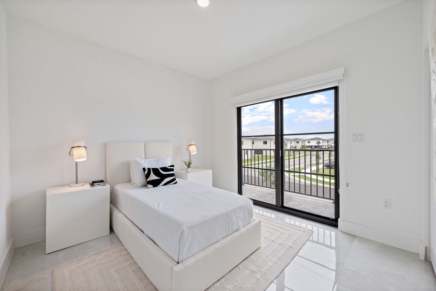 Representative furnished interior of a home built from the Model E by Onx Homes in On Alba, Florida City (Image 52).