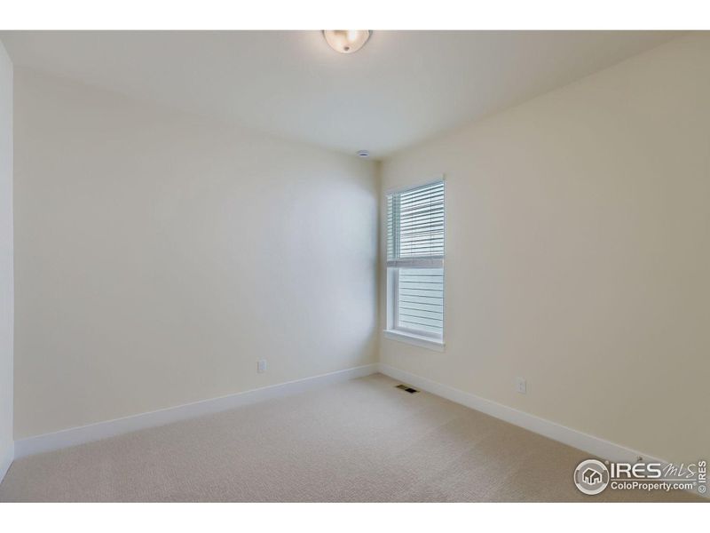 Spacious, unfurnished interior of a new home in RainDance National 60/70, Windsor (Image 17).