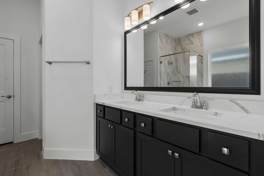 Representative furnished interior of a home built from the Carlisle by Chesmar Homes in Sunterra, Katy (Image 7).