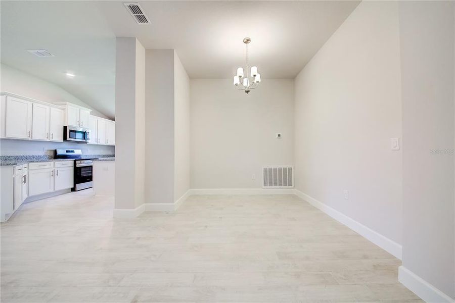 Spacious, unfurnished interior of a new home in Aviary at Rutland Ranch, Parrish (Image 14).