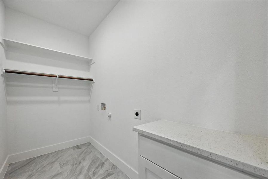 Laundry room with electric dryer hookup, washer hookup, and hookup for a gas dryer