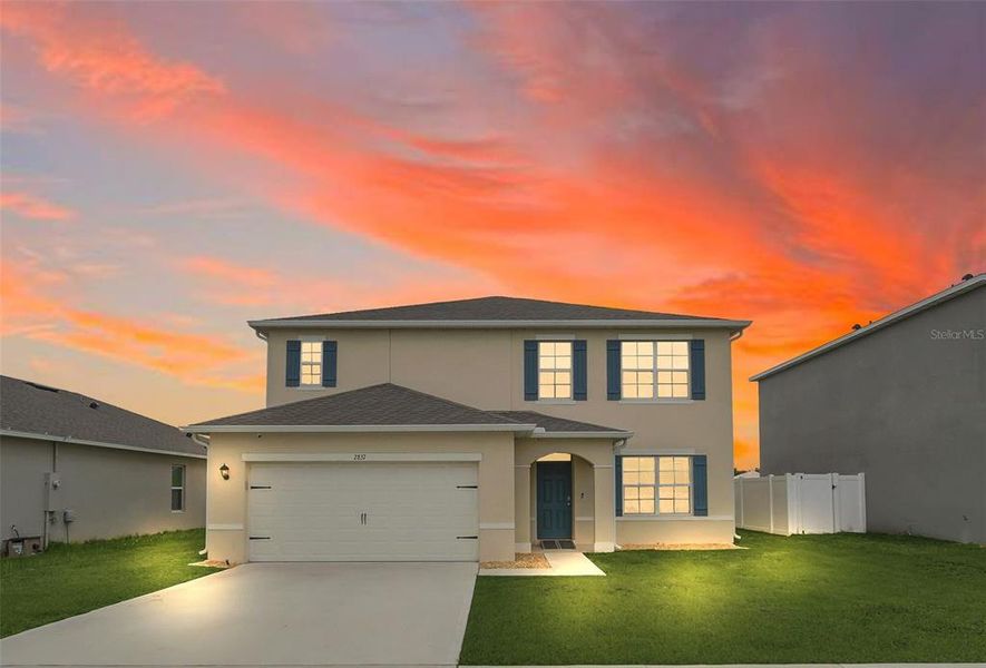Front exterior of a new home in Greenbrier, Tavares, FL, highlighting curb appeal (Image 25).