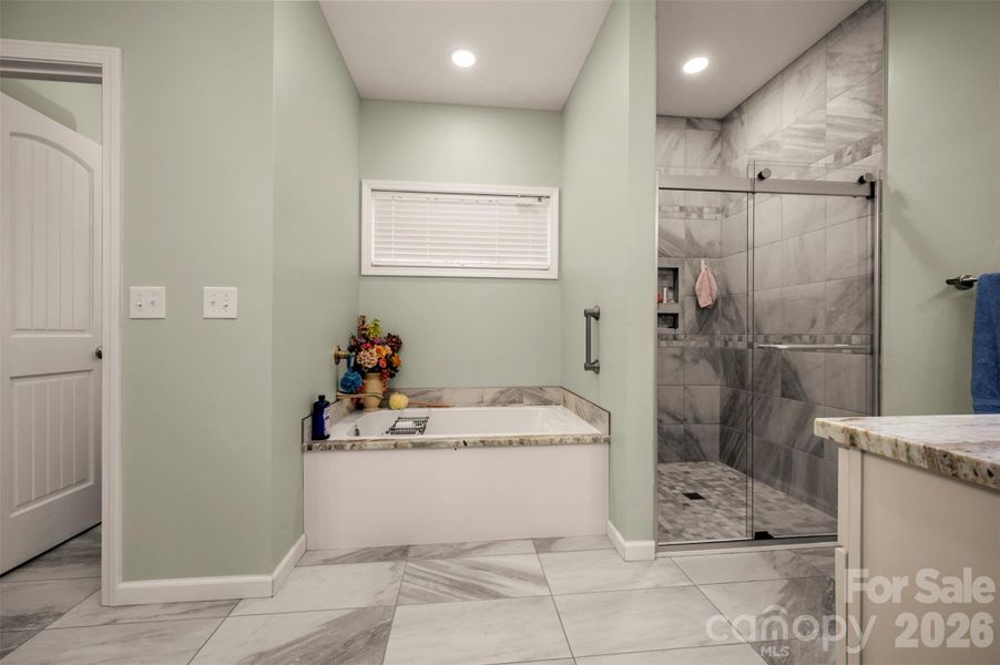 Well appointed ensuite bath with soothing colors, double vanities and gorgeous granite tops. Well appointed ensuite bath with soothing colors, double vanities and gorgeous granite tops.