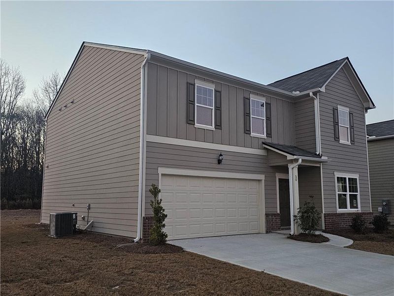 Front exterior of a new home in Casteel, Bethlehem, GA, highlighting curb appeal (Image 1). Front exterior of a new home in Casteel, Bethlehem, GA, highlighting curb appeal (Image 1).