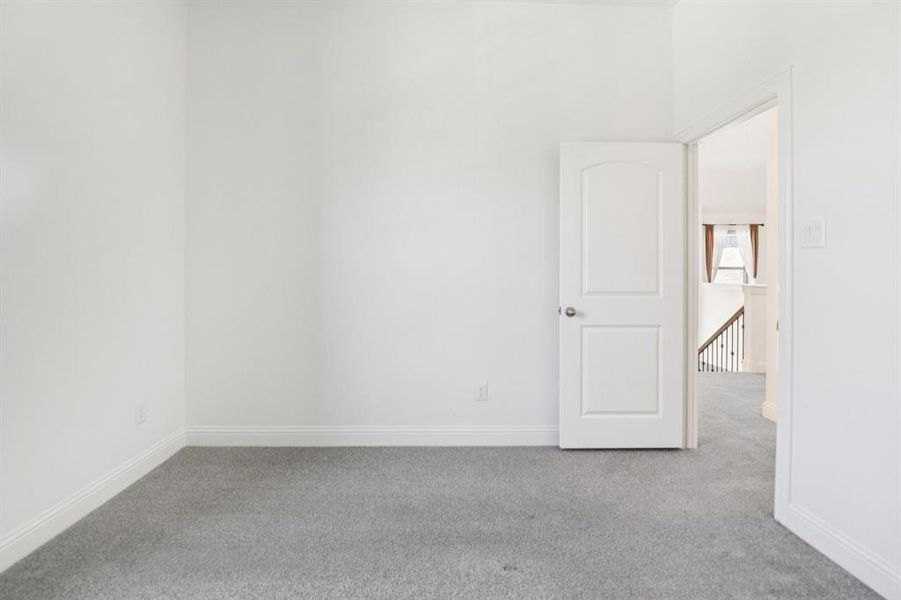 Unfurnished room with carpet floors Unfurnished room with carpet floors