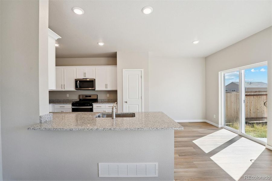 Furnished interior view inside a new home in Cottonwood Greens, Fort Lupton (Image 4).