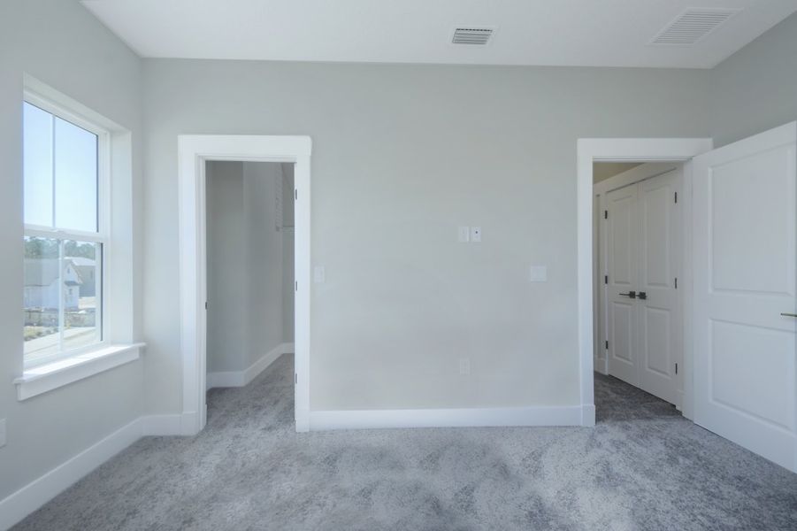 Representative unfurnished interior of a home built from the Julington by Riverside Homes in Hidden Creek at SilverLeaf 70' Series, St. Augustine (Image 16).