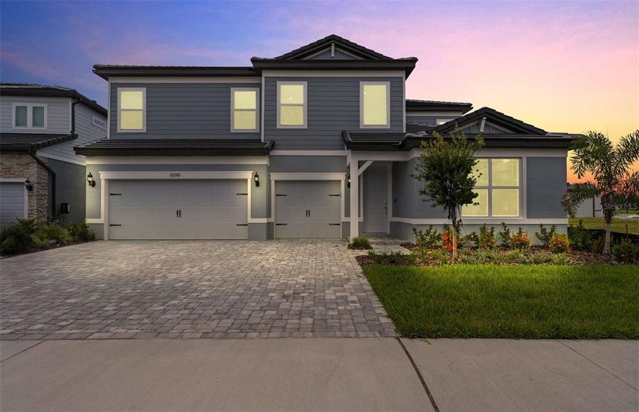 Front exterior of a new home in Two Rivers, Zephyrhills, FL, highlighting curb appeal (Image 1).