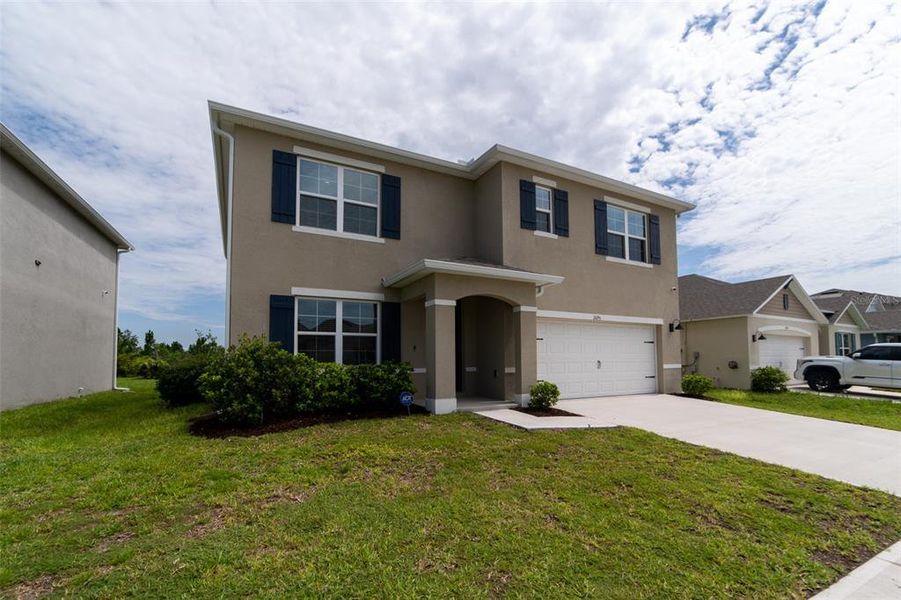 Front exterior of a new home in , Harmony, FL, highlighting curb appeal (Image 29).