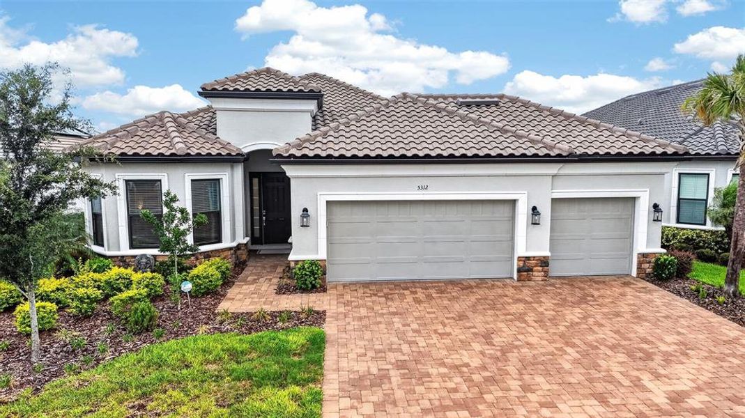 Front exterior of a new home in , Palmetto, FL, highlighting curb appeal (Image 27). Front exterior of a new home in , Palmetto, FL, highlighting curb appeal (Image 27).