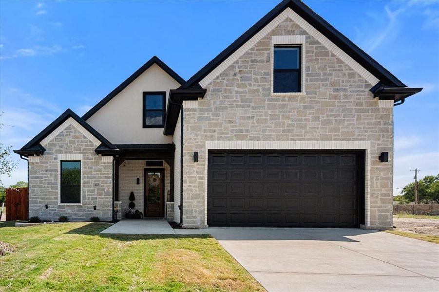 Front exterior of a new home in , Red Oak, TX, highlighting curb appeal (Image 1). Front exterior of a new home in , Red Oak, TX, highlighting curb appeal (Image 1).