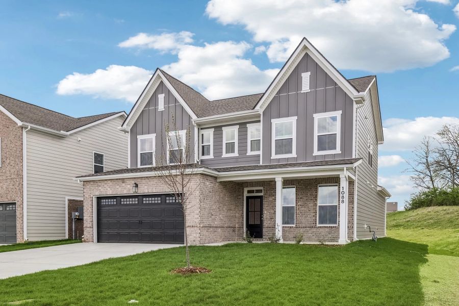 Front exterior of a new home in Ascent at Arbor Ridge, La Vergne, TN, highlighting curb appeal (Image 2). Front exterior of a new home in Ascent at Arbor Ridge, La Vergne, TN, highlighting curb appeal (Image 2).