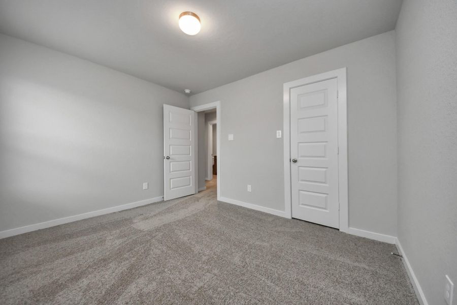 Generously sized secondary bedrooms featuring spacious closets, soft and inviting carpetingunderfoot, large windows allowing plenty of natural light, and the added touch of privacyblinds for your personal retreat. Sample photo of completed home with similar floor plan. Actual colors and selections may vary. Generously sized secondary bedrooms featuring spacious closets, soft and inviting carpetingunderfoot, large windows allowing plenty of natural light, and the added touch of privacyblinds for your personal retreat. Sample photo of completed home with similar floor plan. Actual colors and selections may vary.