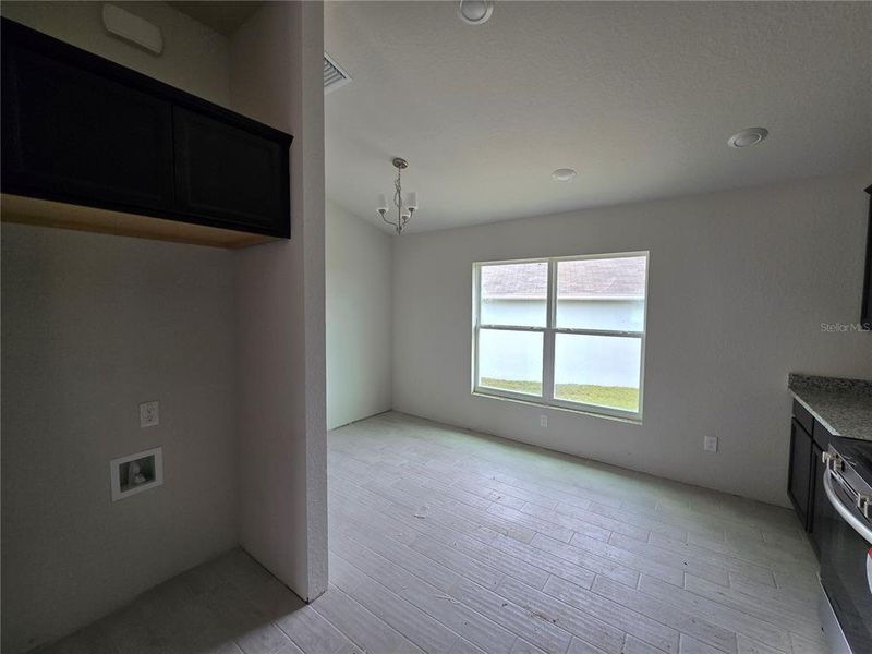 refrigerator and breakfast nook