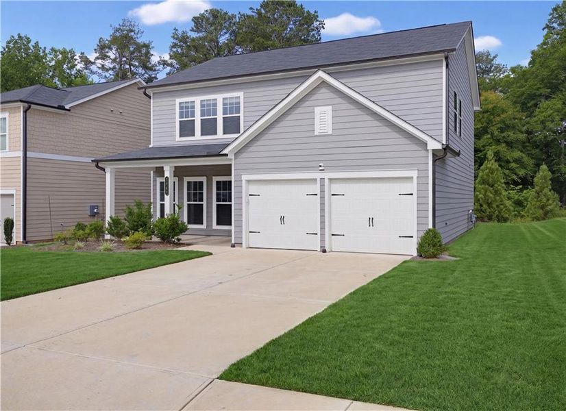Front exterior of a new home in , Conyers, GA, highlighting curb appeal (Image 2). Front exterior of a new home in , Conyers, GA, highlighting curb appeal (Image 2).