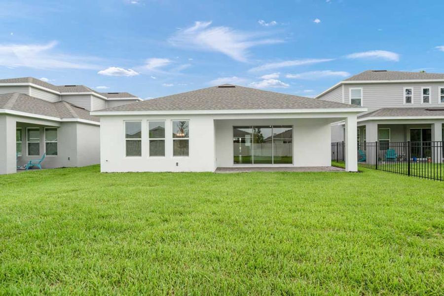 Front exterior of a new home in The Cove at West Port, Port Charlotte, FL, highlighting curb appeal (Image 17).
