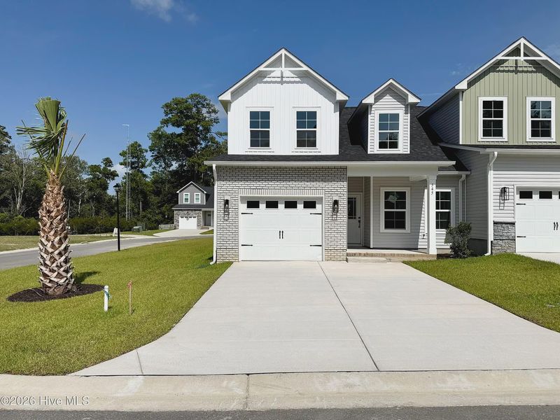 Front exterior of a new home in Autumn Trail, Bolivia, NC, highlighting curb appeal (Image 1). Front exterior of a new home in Autumn Trail, Bolivia, NC, highlighting curb appeal (Image 1).