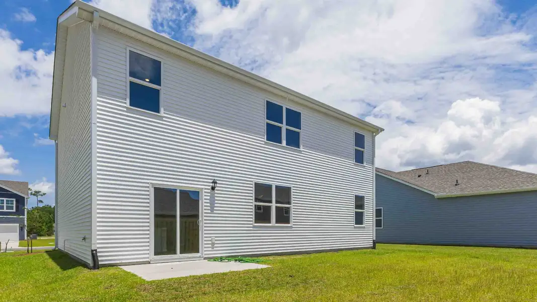 Front exterior of a new home in Bella Point, Bolivia, NC, highlighting curb appeal (Image 17).