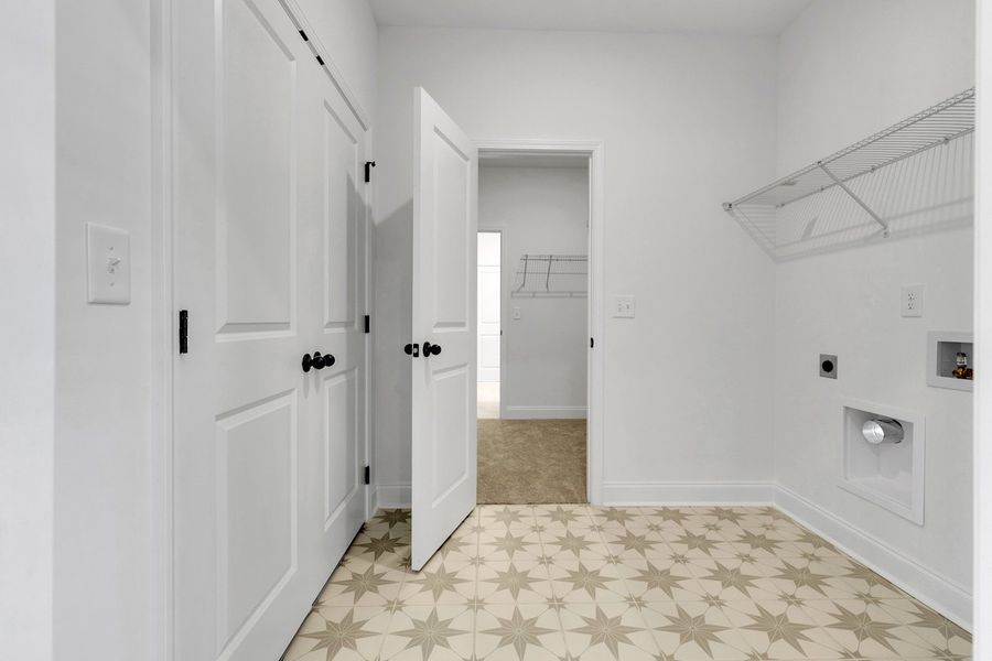 Representative unfurnished interior of a home built from the Titusville II by Regent Homes in Marlon's Creek, Spring Hill (Image 31).