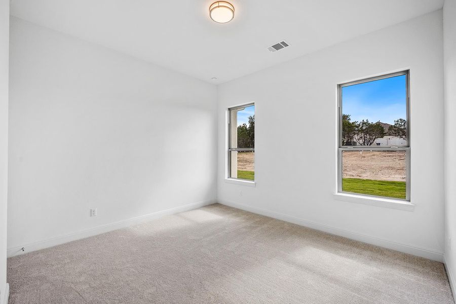 Ensuite #2 Unfurnished room with light carpet and baseboards