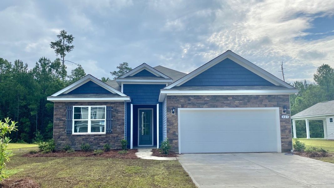 Front exterior of a new home in The Forest at Black Bear, Loris, SC, highlighting curb appeal (Image 1). Front exterior of a new home in The Forest at Black Bear, Loris, SC, highlighting curb appeal (Image 1).