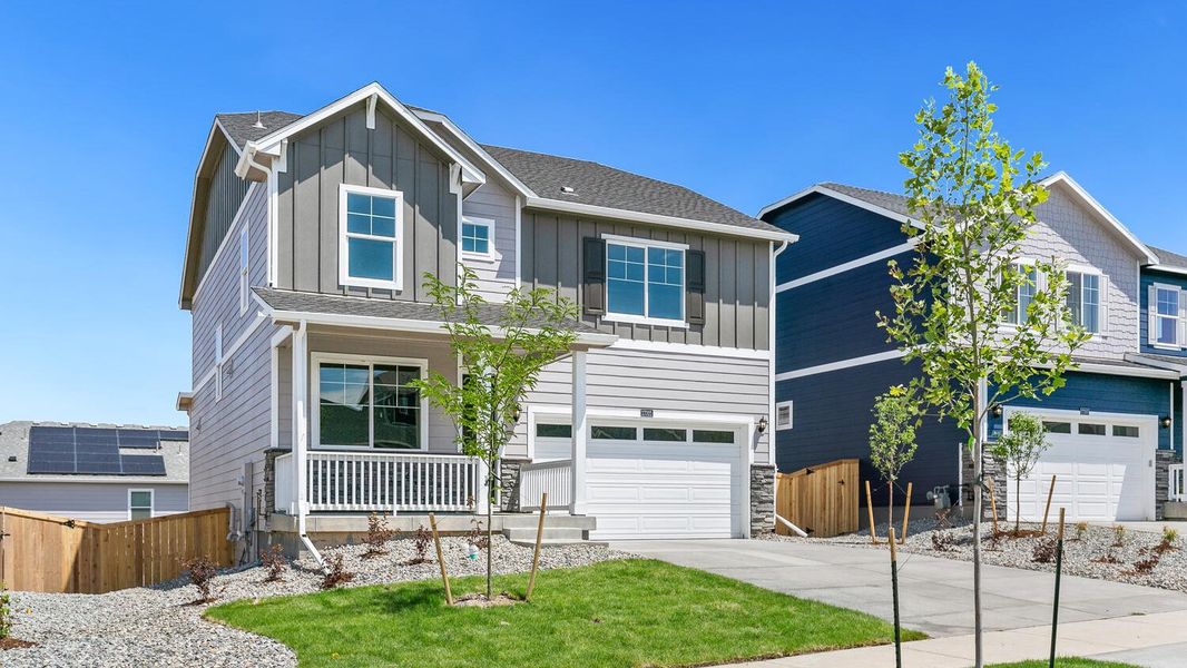 Front exterior of a new home in Trails at Crowfoot, Parker, CO, highlighting curb appeal (Image 2). Front exterior of a new home in Trails at Crowfoot, Parker, CO, highlighting curb appeal (Image 2).