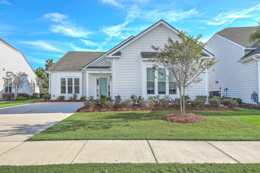 Exterior details and patio area of a home in K. Hovnanian's® Four Seasons at Lakes of Cane Bay, Summerville (Image 22).