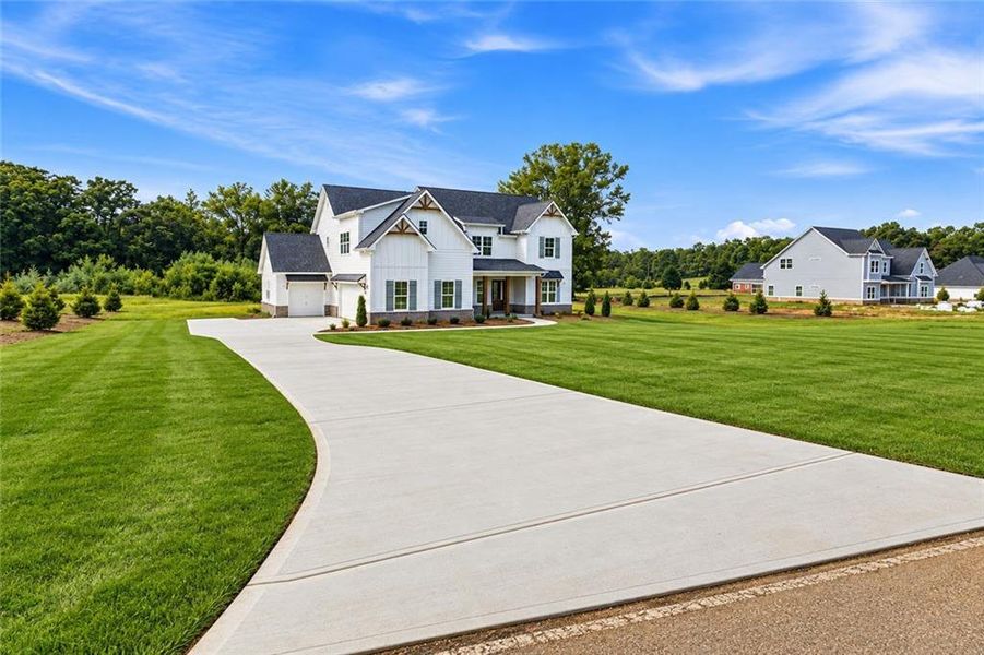 Front exterior of a new home in , Hampton, GA, highlighting curb appeal (Image 27). Front exterior of a new home in , Hampton, GA, highlighting curb appeal (Image 27).