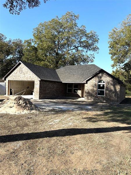 Unfinished property with a garage