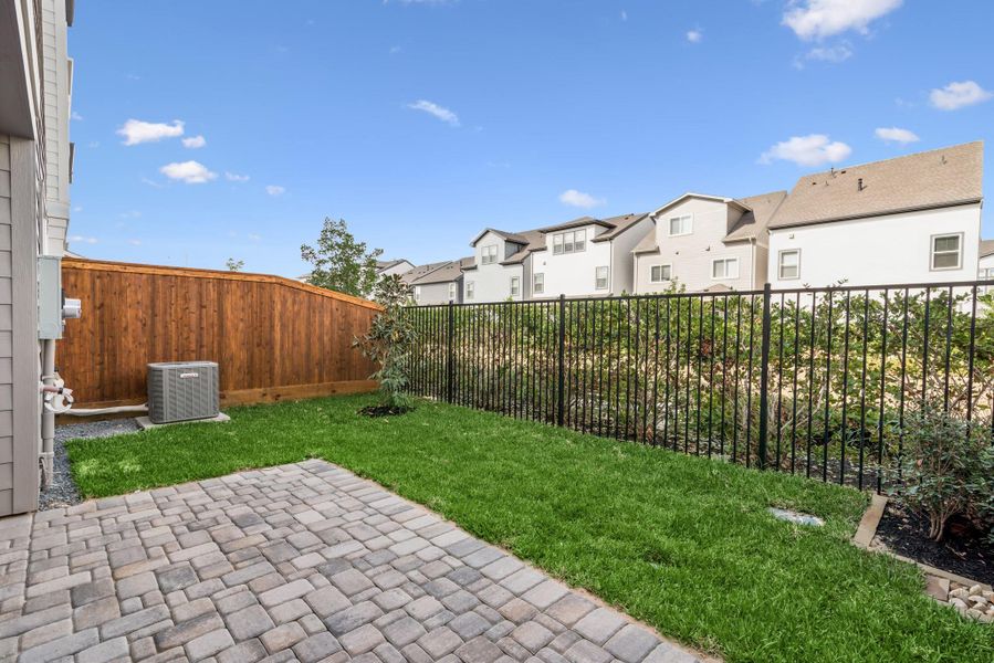 Exterior details and patio area of a home in Retreat at Oak Park, Houston (Image 4).