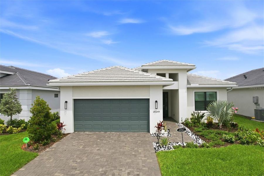 Front exterior of a new home in , Bradenton, FL, highlighting curb appeal (Image 29).