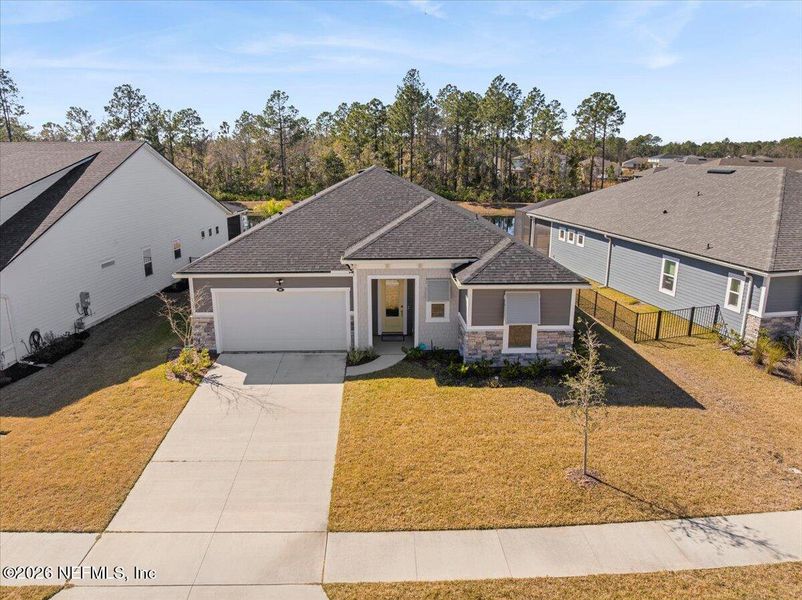 Front exterior of a new home in , St. Johns, FL, highlighting curb appeal (Image 25).