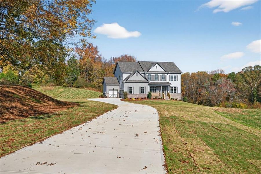 Front exterior of a new home in , Gainesville, GA, highlighting curb appeal (Image 1). Front exterior of a new home in , Gainesville, GA, highlighting curb appeal (Image 1).