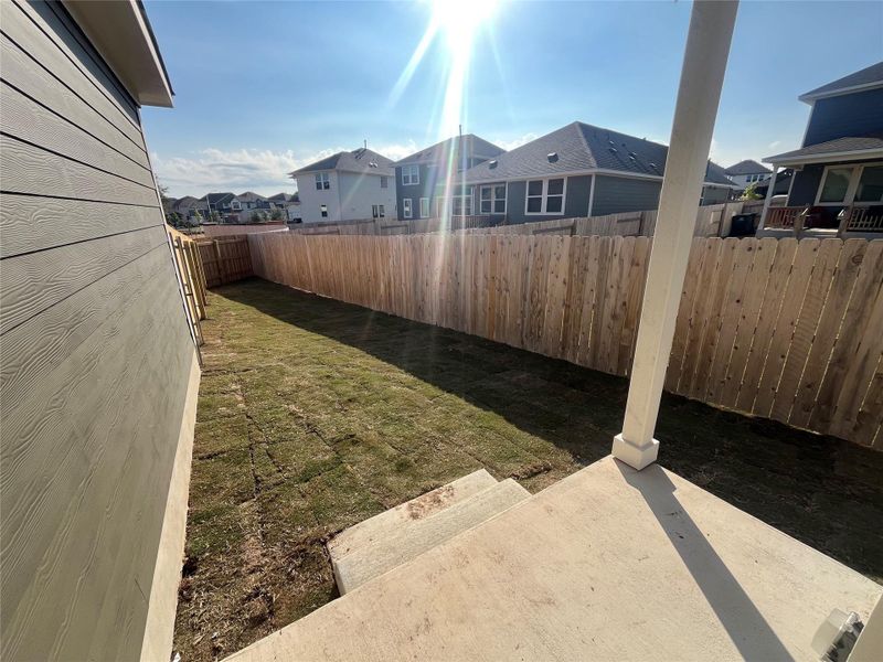 Exterior details and patio area of a home in The Cottages at Lariat, Liberty Hill (Image 22).