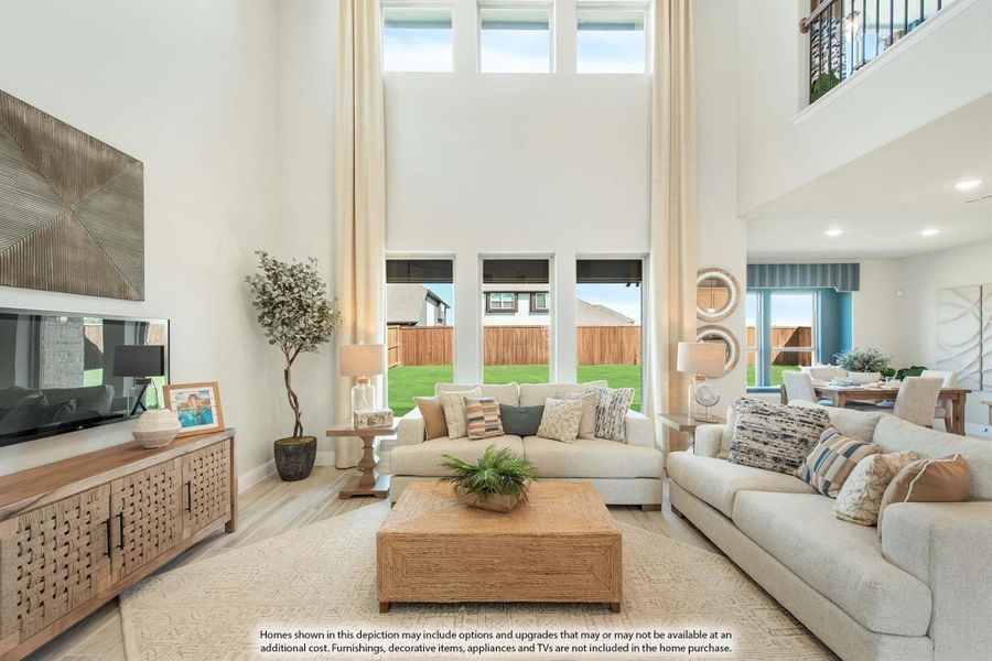 Living room with two-story ceiling, large windows, two neutral sofas, and wood coffee table Living room with two-story ceiling, large windows, two neutral sofas, and wood coffee table