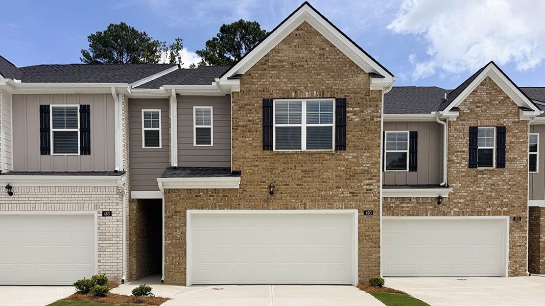 Front exterior of a new home in Independence Villas and Townhomes, Loganville, GA, highlighting curb appeal (Image 1). Front exterior of a new home in Independence Villas and Townhomes, Loganville, GA, highlighting curb appeal (Image 1).