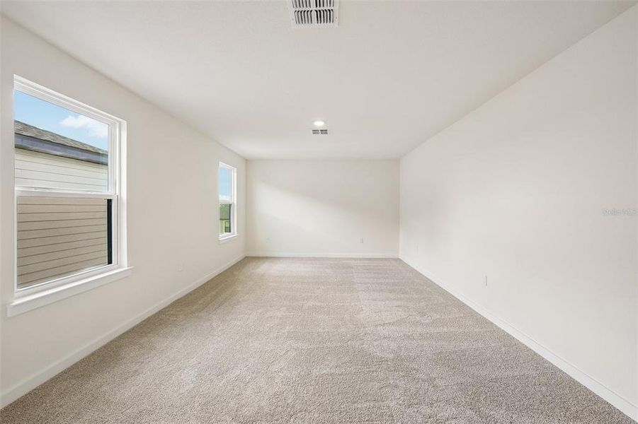 Spacious, unfurnished interior of a new home in Grasslands West, Lakeland (Image 28).